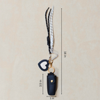 Keychain with measurements on a beige background