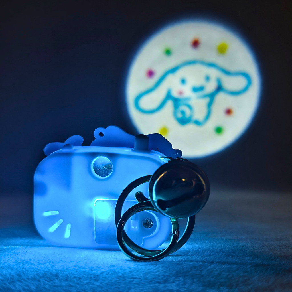 Toy camera with a projected image of a cartoon character on a dark background