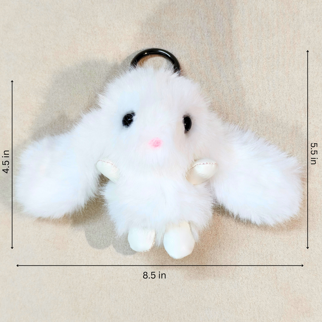 White fluffy bunny plush keychain with long floppy ears, black ring, and dimension markings showing 8.5 in width, 5.