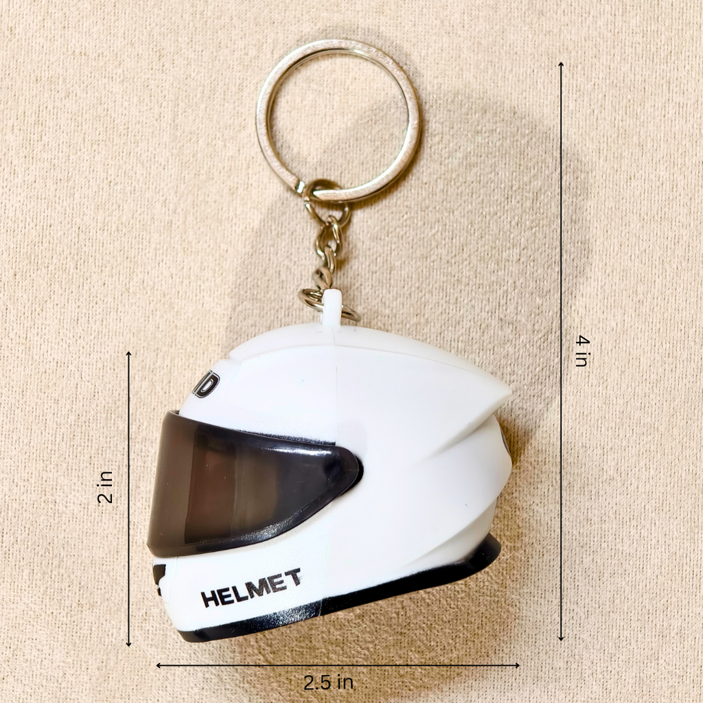 A small white helmet-shaped keychain with a dark visor and metal key ring, shown on a beige textured background with dimension lines indicating 2 in height, 2.5 in width, and 4 in overall size.