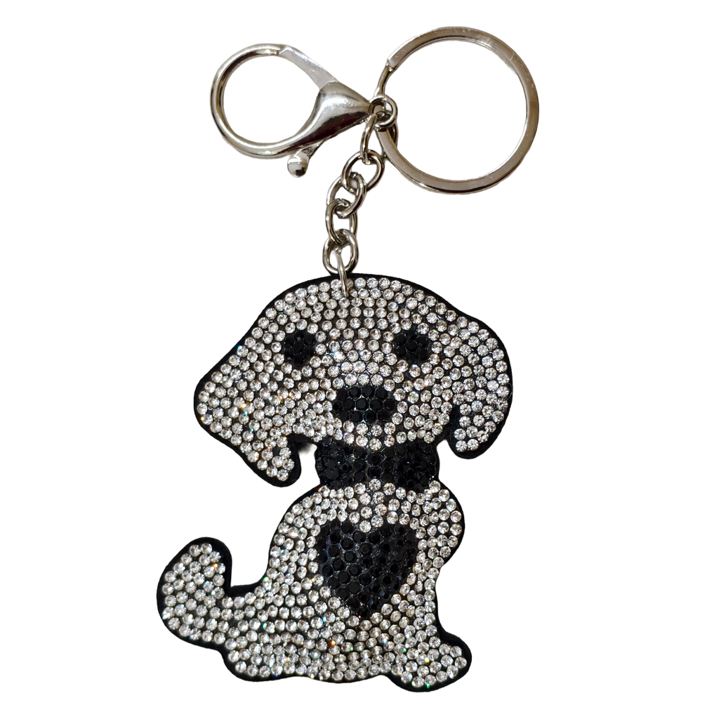 A dog-shaped keychain embellished with rhinestones, featuring a silver-tone clasp and split ring, set against a plain white background.