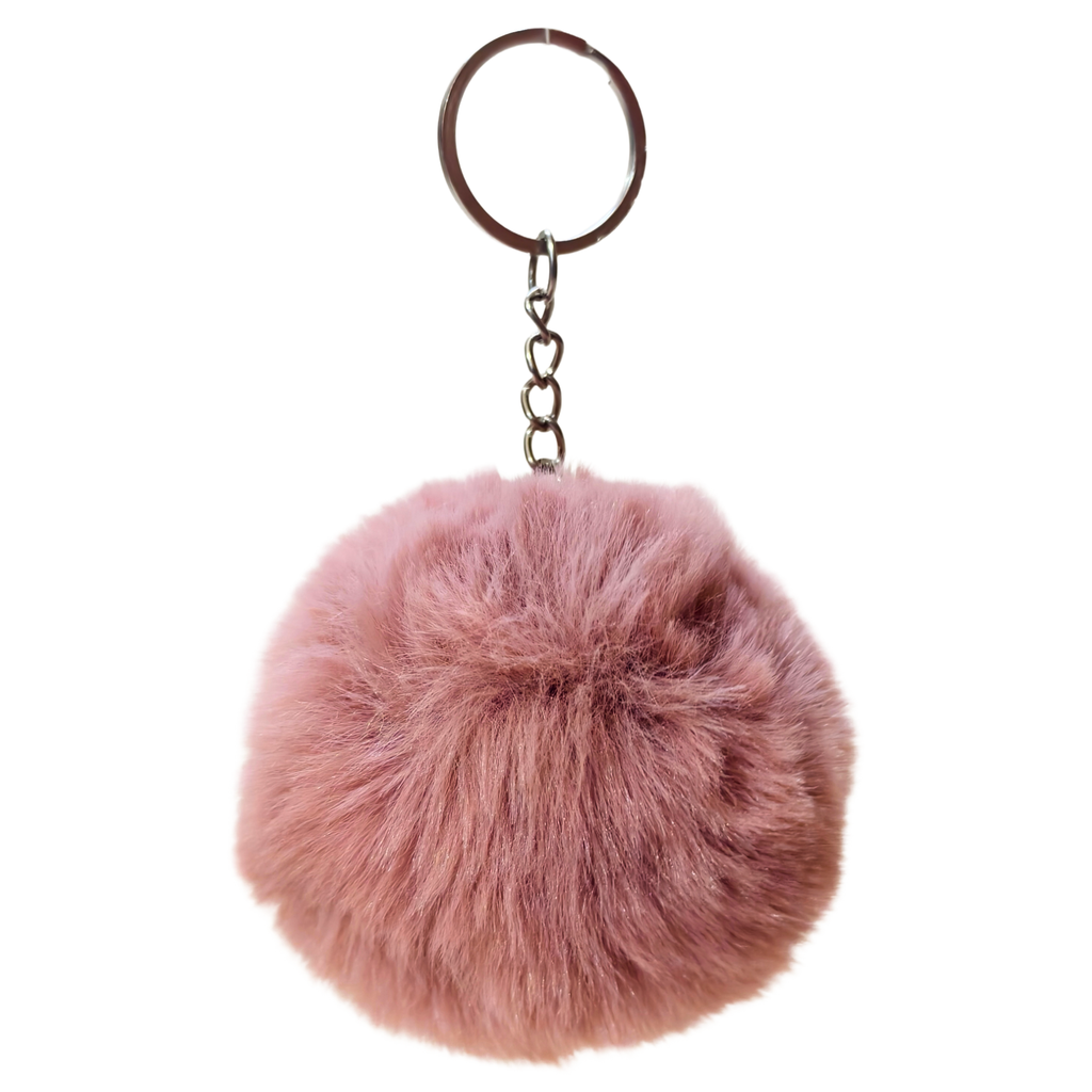 Pink fluffy keychain on a white background
