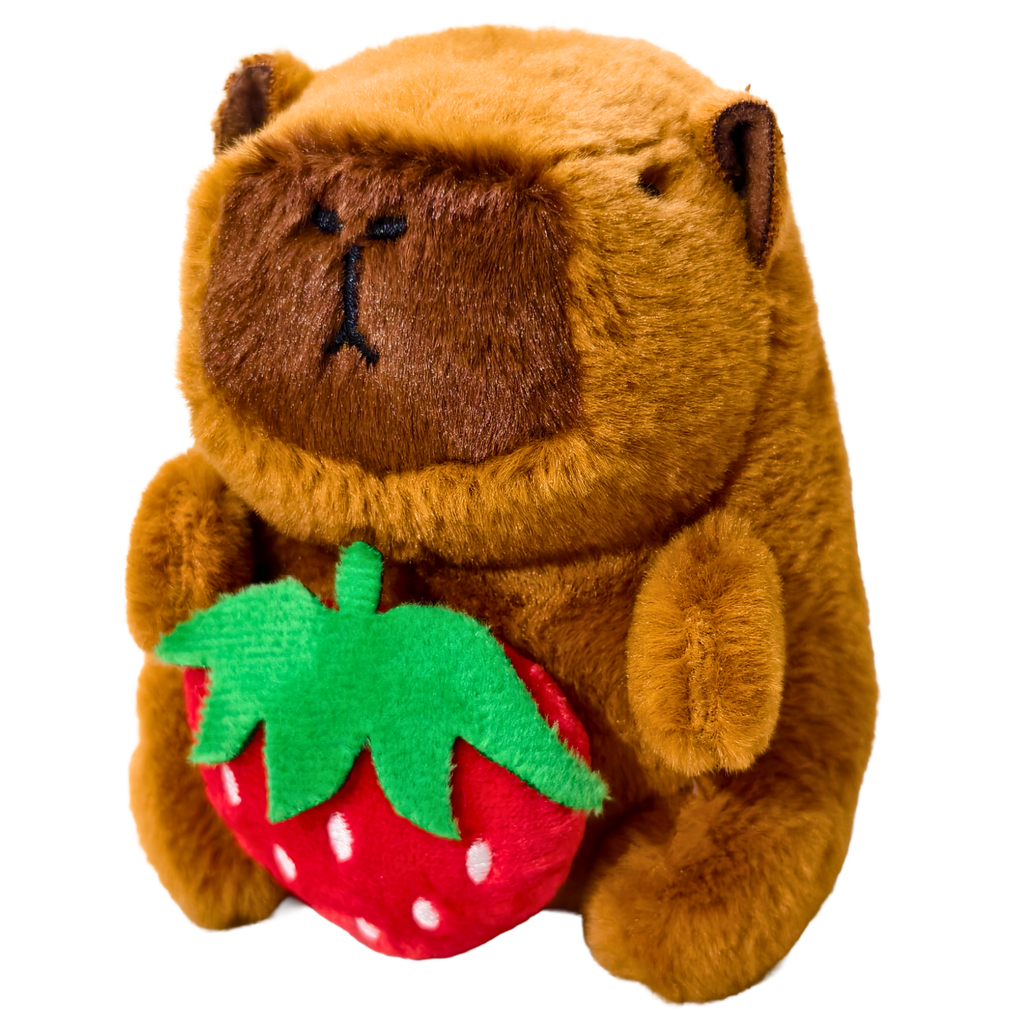 Plush toy bear holding a strawberry on a white background