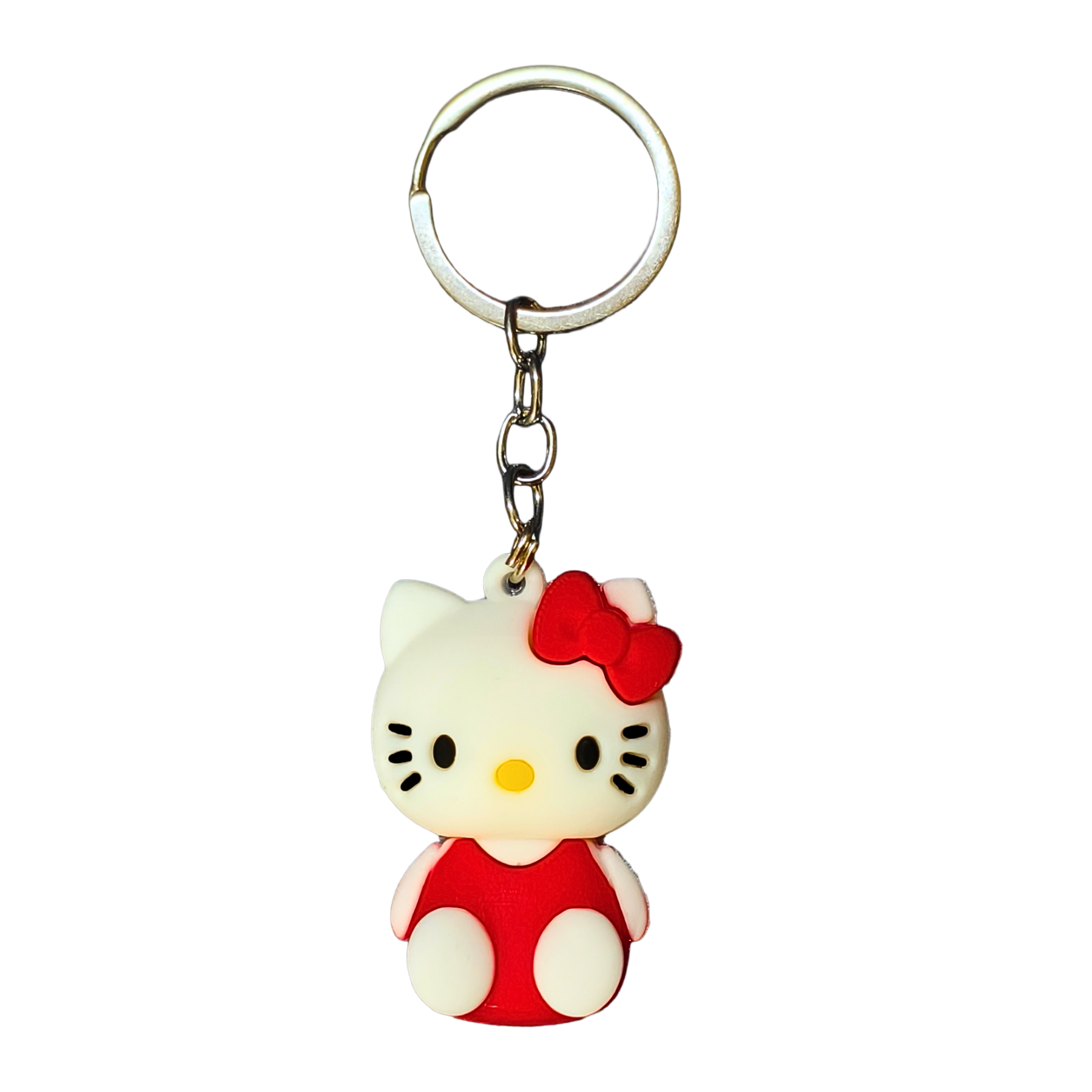 Keychain with a cartoon character wearing a red outfit and bow on a white background