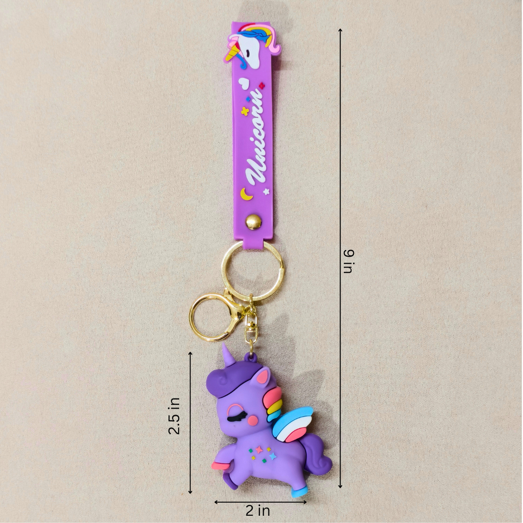 Purple unicorn keychain with gold accents on a beige background