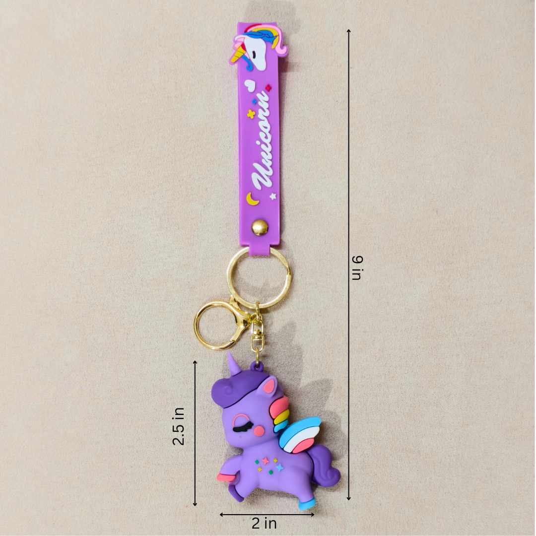 Purple unicorn keychain with gold accents on a beige background