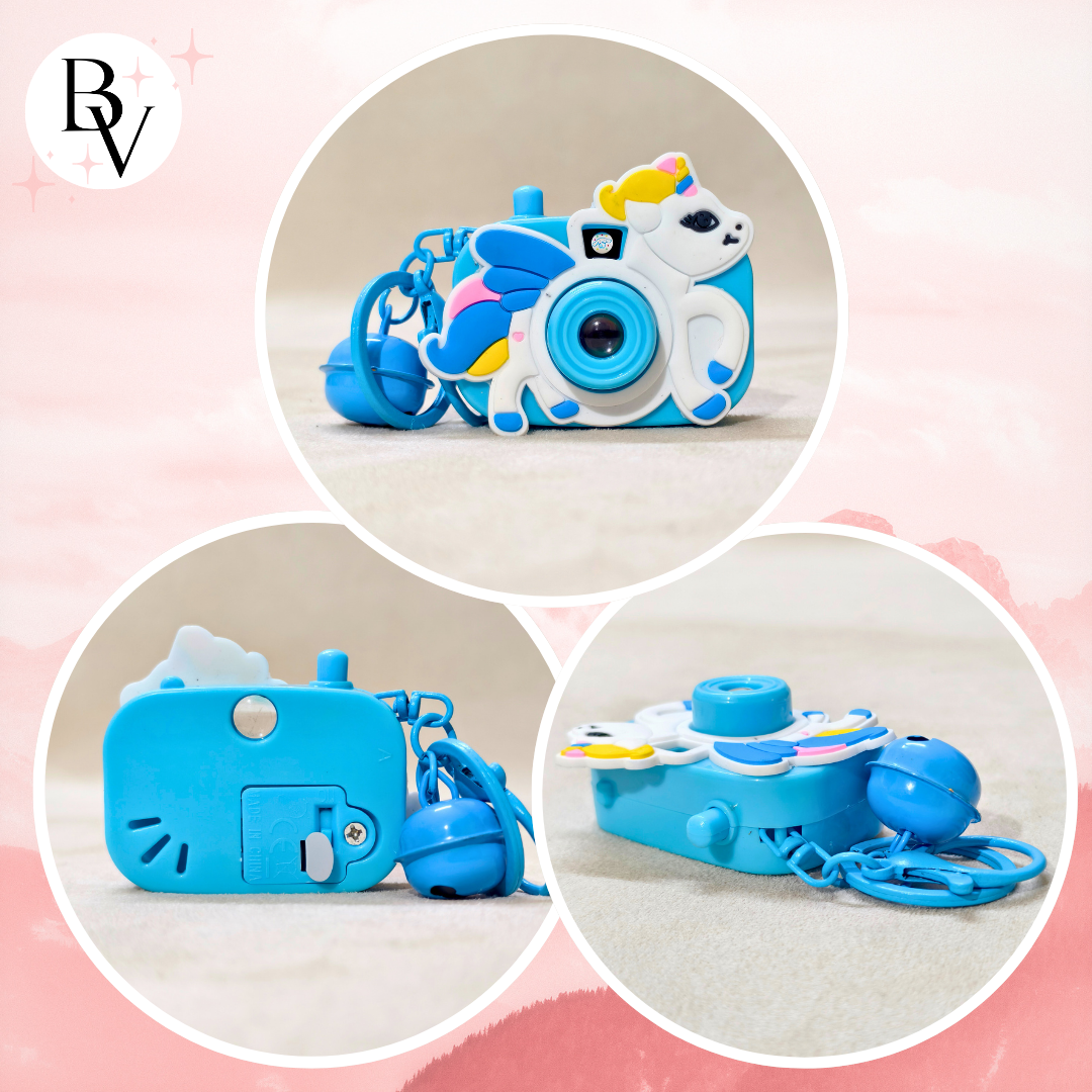 Blue toy camera with colorful design on a pink background