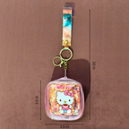 Keychain with Hello Kitty design and measurements on a brown background
