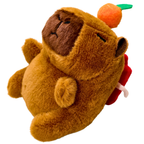 Plush toy resembling a brown animal with a carrot on a white background