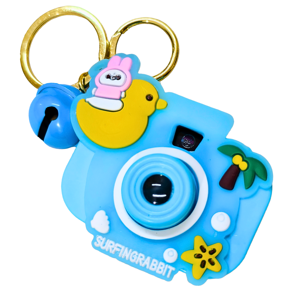 Toy camera keychain with a cartoon character on a white background