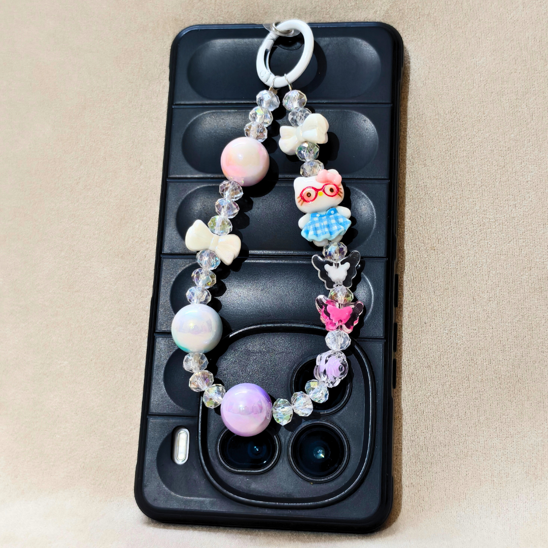 Phone case with decorative charm featuring colorful beads and animal figures on a beige background