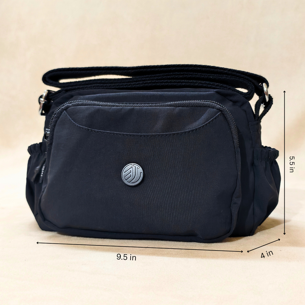 Black Korean Sling Bag With Measurements In Front Of Beige Background.