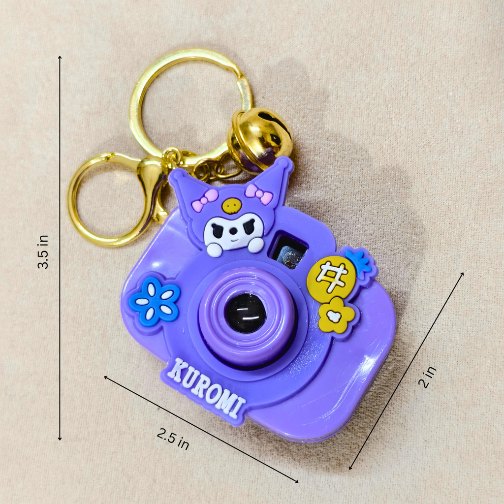 Purple camera-shaped keychain with cartoon character on a beige background