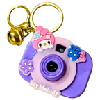 Purple camera-shaped keychain with a character design on a white background