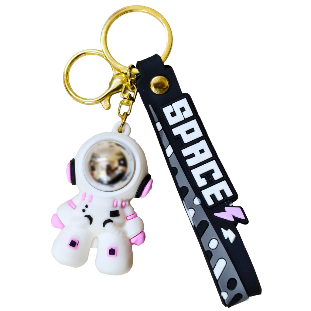 Small Astronaut Keyring On White Background.