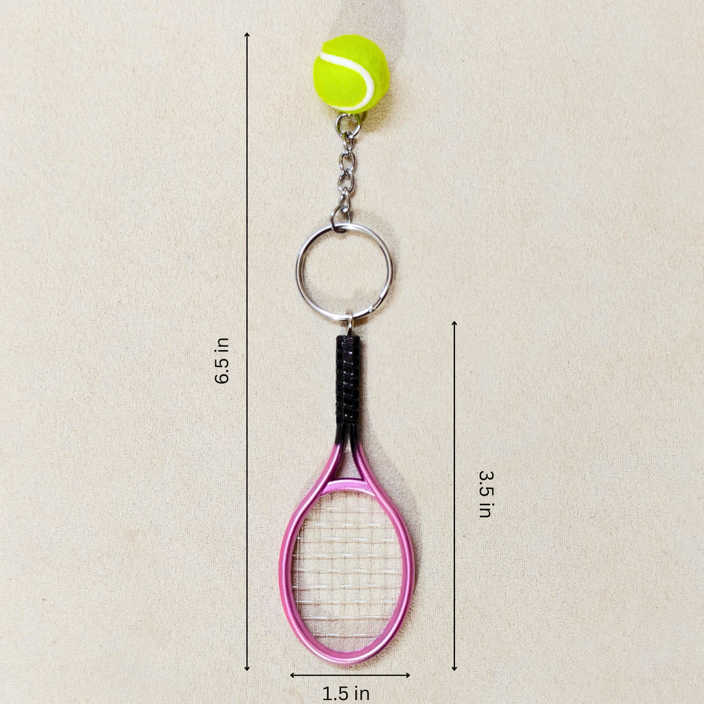 A tennis-themed keychain featuring a lime green tennis ball, silver key ring, and a pink tennis racket charm, shown with dimension lines and text indicating measurements of 6.5 in, 3.