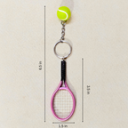 A tennis-themed keychain featuring a lime green tennis ball, silver key ring, and a pink tennis racket charm, shown with dimension lines and text indicating measurements of 6.5 in, 3.