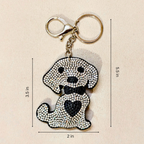 A dog-shaped rhinestone keychain with a gold-tone clasp and split ring, shown on a light beige background with dimension lines indicating 3.5 in height, 2 in width, and 5.