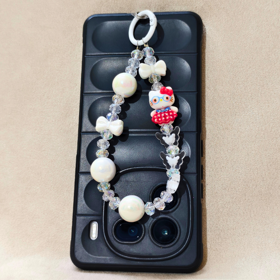Phone case with a Hello Kitty charm on a beige background