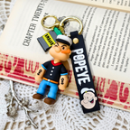 Popeye Keyring  With Props On  Crochet Background.