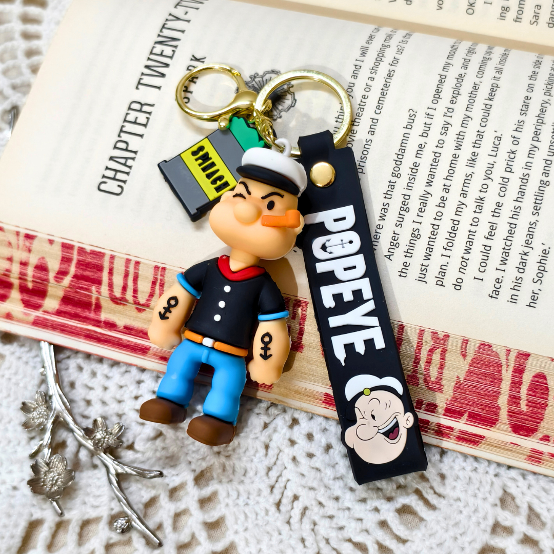 Popeye Keyring  With Props On  Crochet Background.