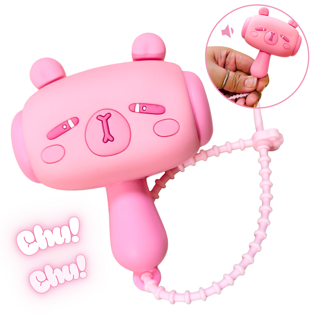 Pink toy with a chain, resembling a phone, on a white background.