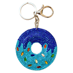 Donut-shaped keychain with blue beads and colorful accents on a white background