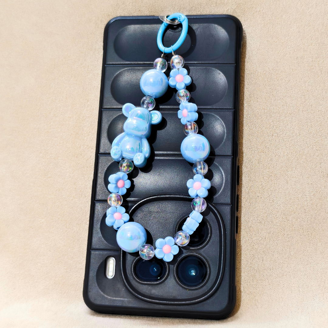 Phone case with a blue beaded chain on a beige background