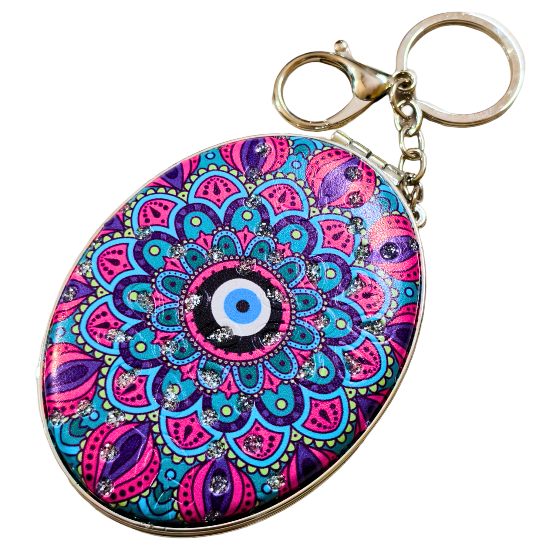 Oval keychain featuring a vibrant mandala design with a central evil eye motif in pink, blue, purple, and black, attached to a gold-tone metal clasp and split ring, shown on a plain white background.