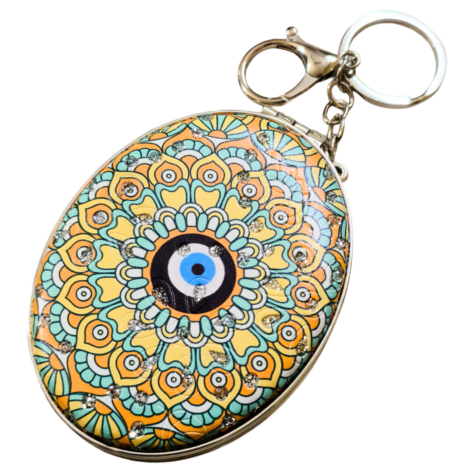 An oval-shaped evil eye keychain featuring a colorful mandala pattern in yellow, teal, orange, and black, with a silver-tone metal clasp and keyring.