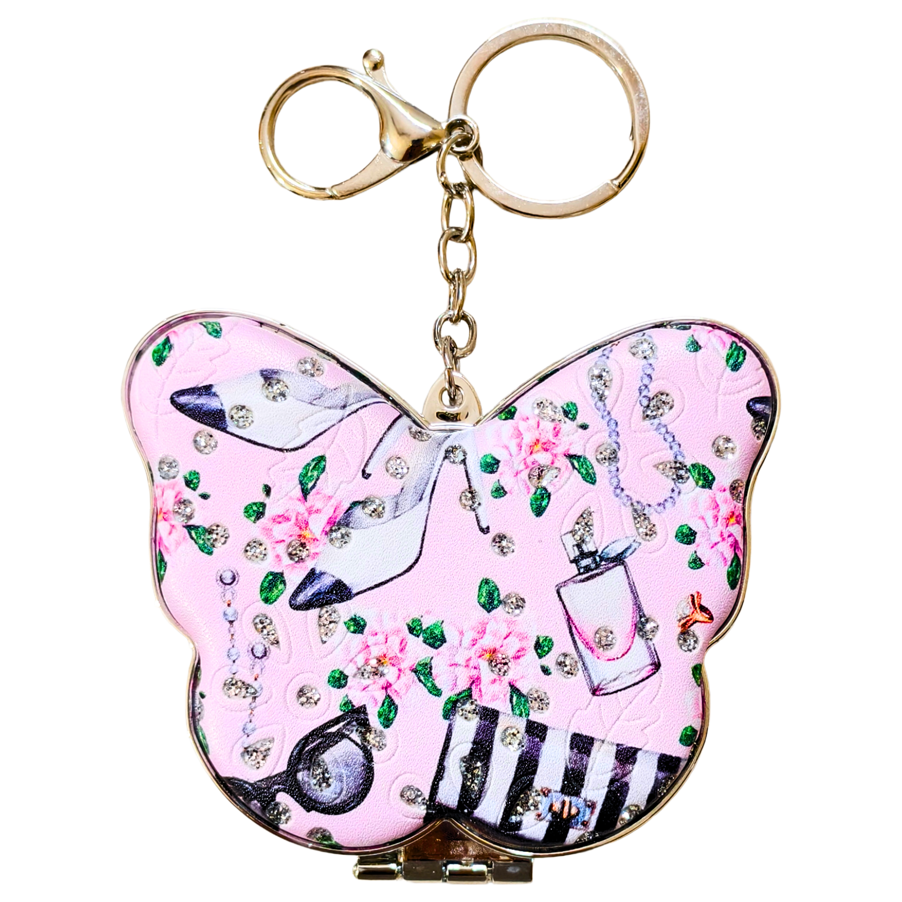 A butterfly-shaped keychain bag with a pink background, decorated with illustrations of high-heeled shoes, perfume bottles, flowers, and rhinestones, attached to a gold-tone keyring.