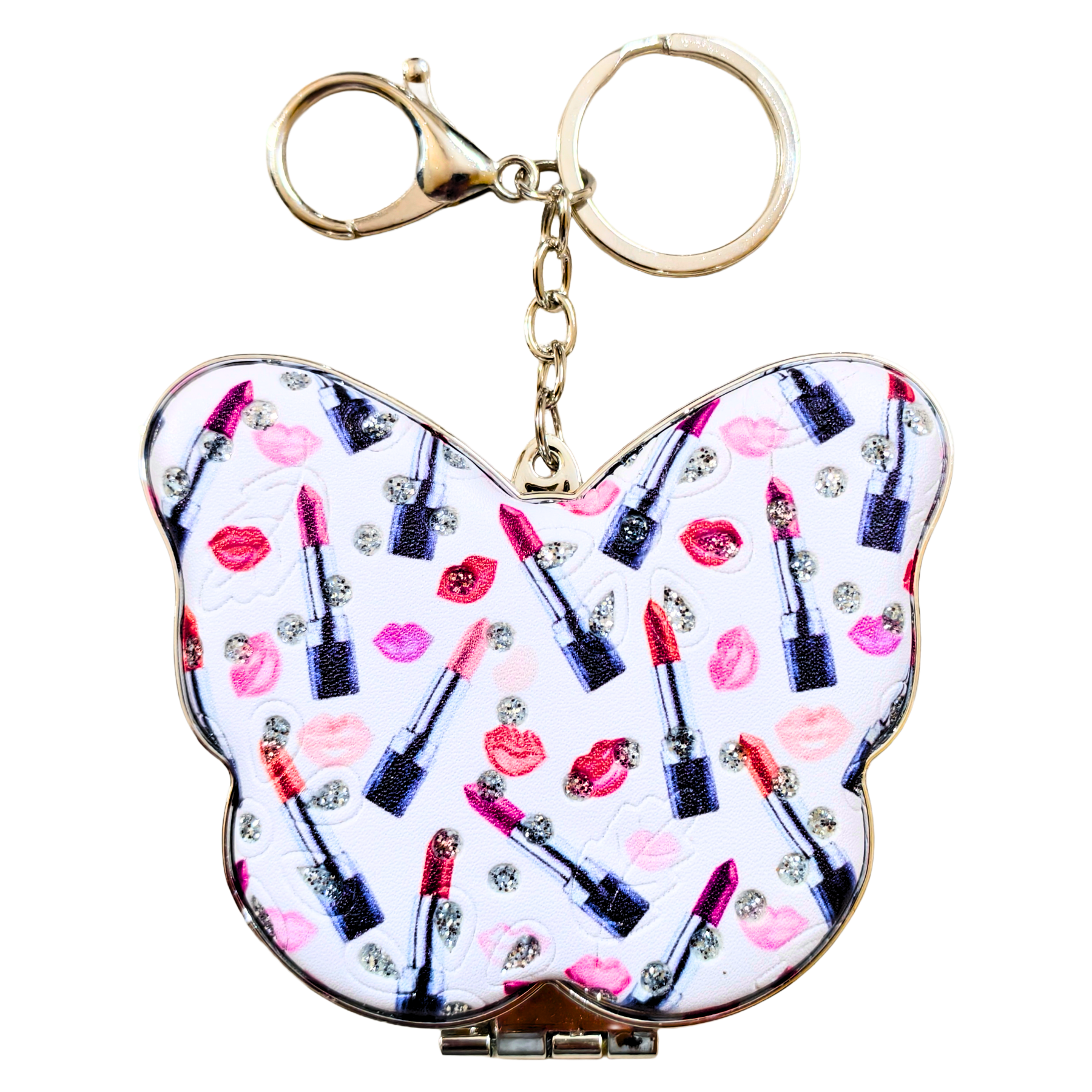 A butterfly-shaped compact mirror keychain featuring a white background printed with pink lip prints, red and pink lipsticks, and rhinestone accents, complete with a gold-tone clasp and key ring.