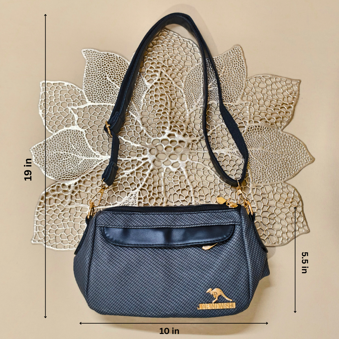 Blue handbag with gold accents on a beige background with measurements