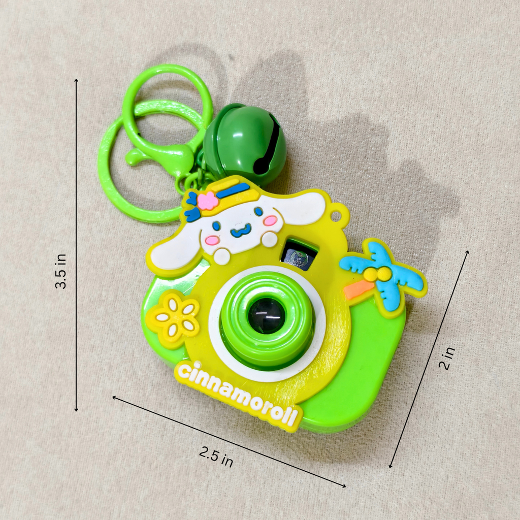 Colorful toy camera keychain with dimensions on a beige background