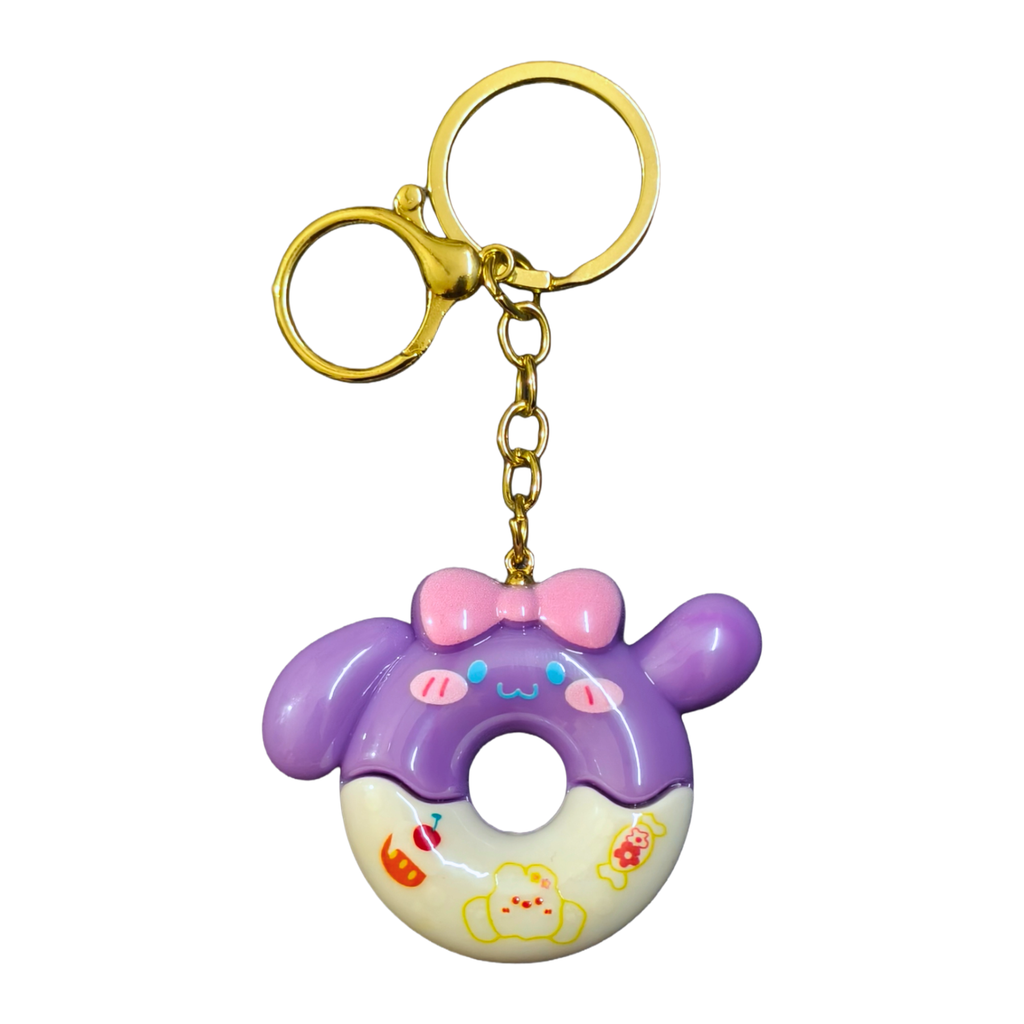 Purple donut-shaped keychain with a gold ring on a white background