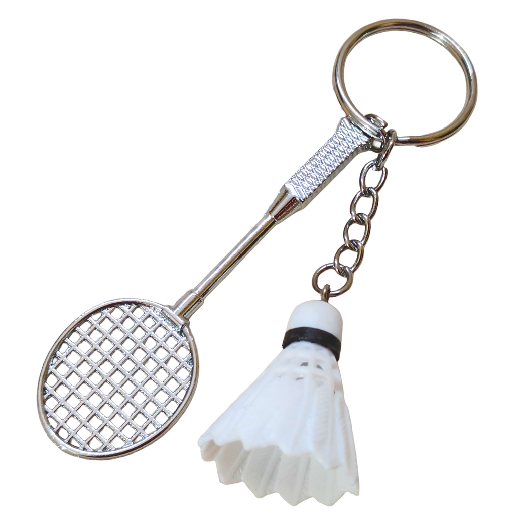 A novelty keychain shaped like a badminton racket with a white shuttlecock charm, attached to a silver metal key ring and chain.