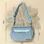 Blue handbag with measurements on a beige background