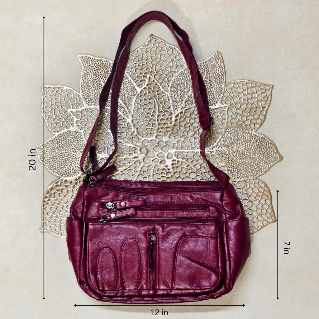 Magenta handbag with measurements on a textured beige background
