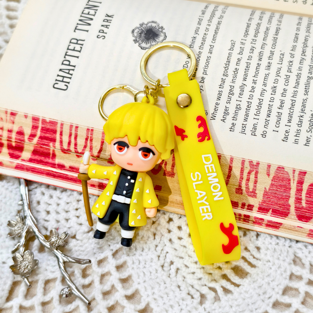 
Zenitsu Keyring  With Props On  Crochet Background.