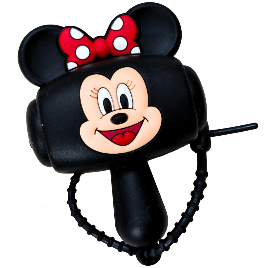 A black plastic toy whistle shaped like Minnie Mouse's head, featuring her red and white polka-dot bow, face, and a coiled black strap, shown on a plain white background.