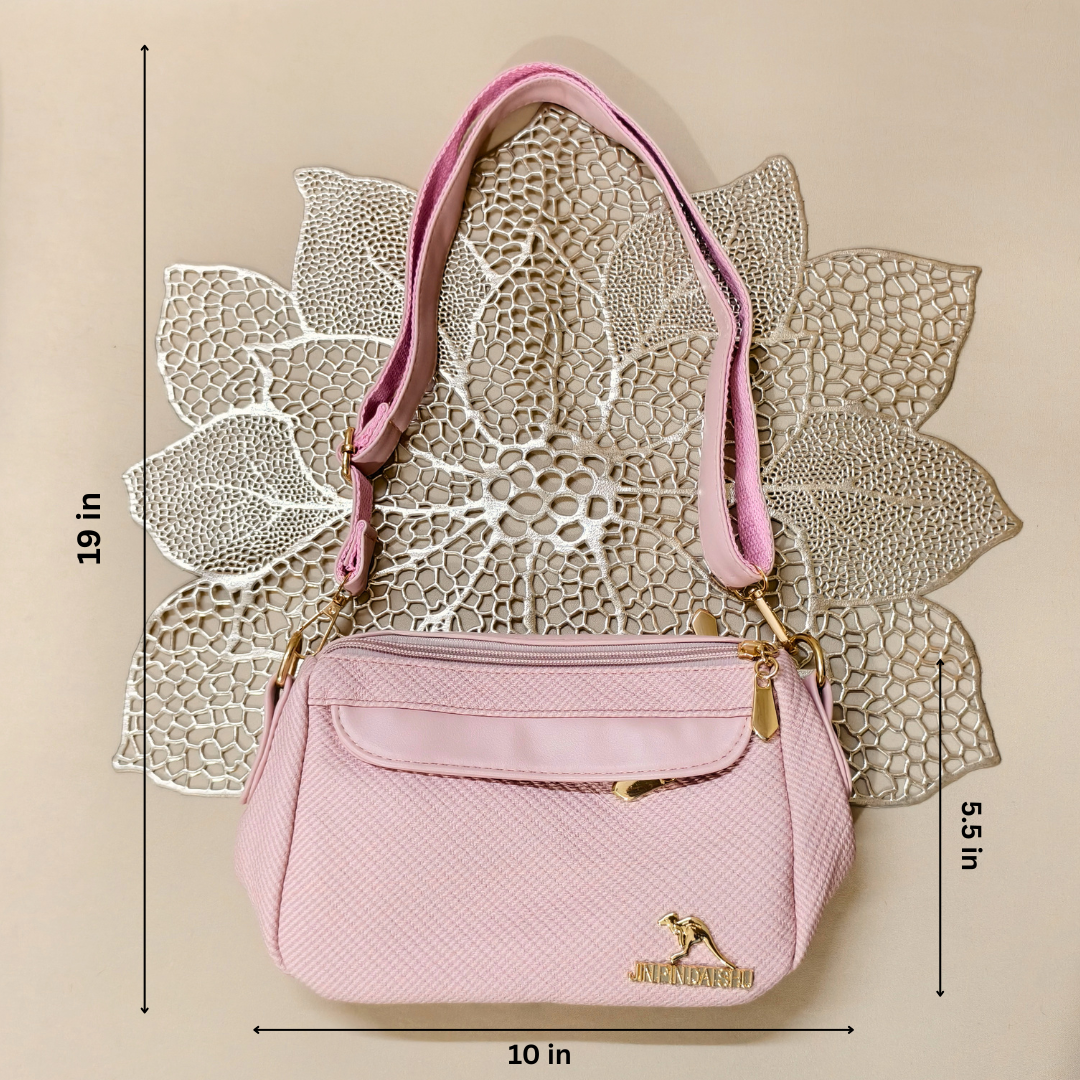 Pink handbag with gold accents on a textured beige background