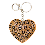 Heart-shaped keychain with leopard print pattern on a white background