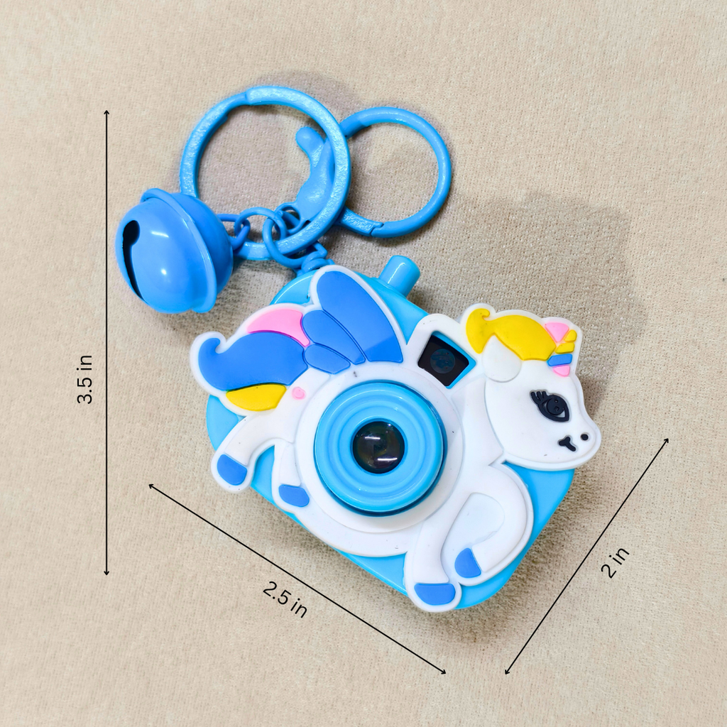 Unicorn-shaped camera keychain with measurements on a beige background