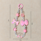 Pink Bow Charm With Measurements In Front OF Beige Background