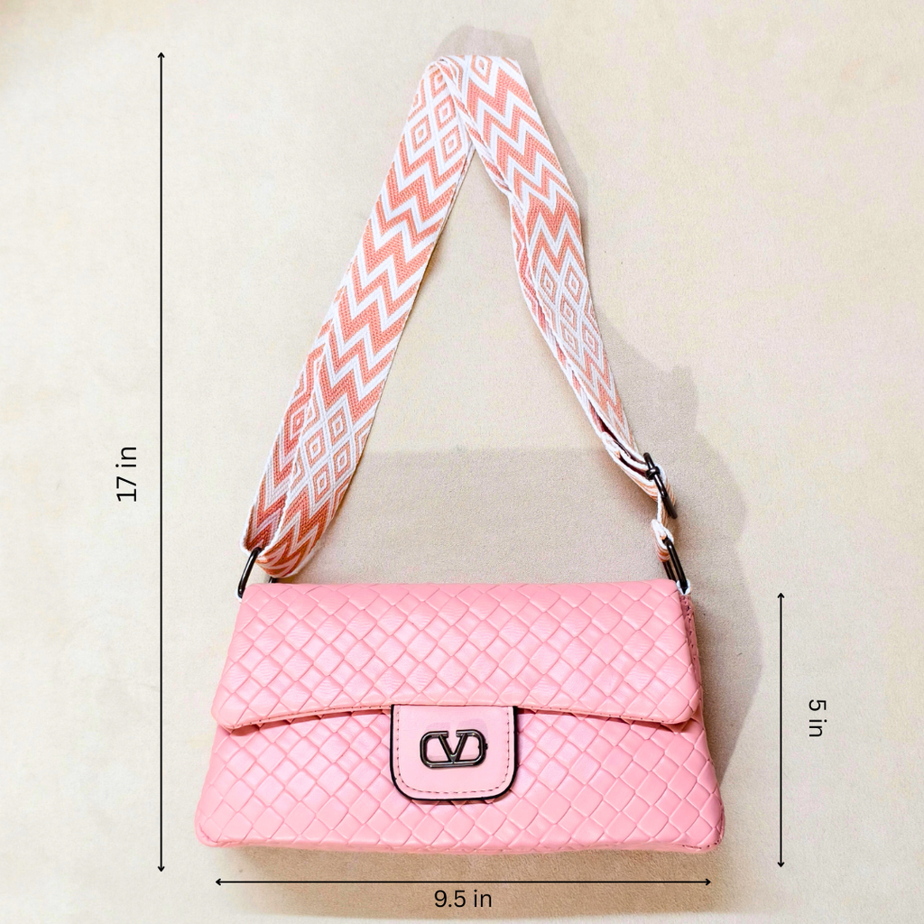Pink quilted handbag with a patterned strap, shown with measurements on a light background