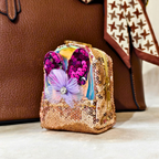 Decorative item with sequins and a flower on a neutral background