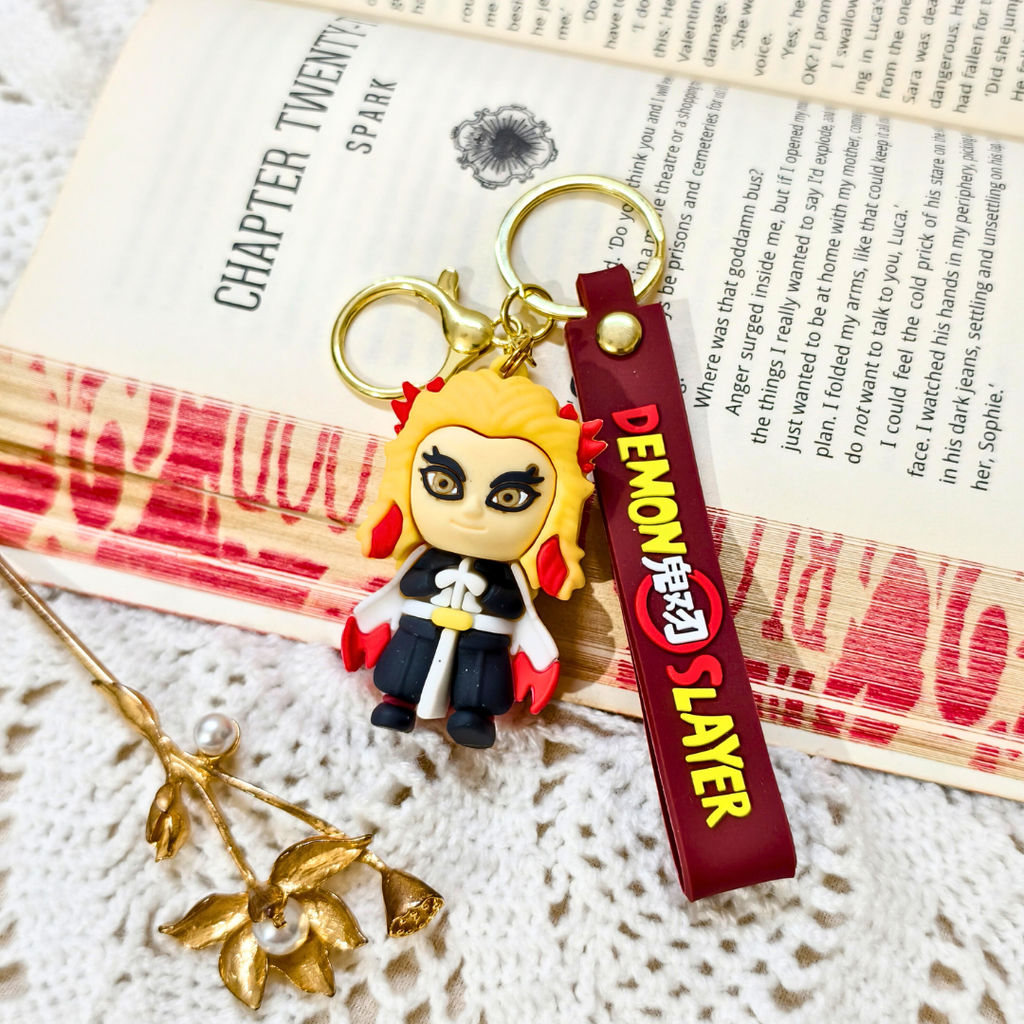 Keychain with 'Demon Slayer' character on a book page