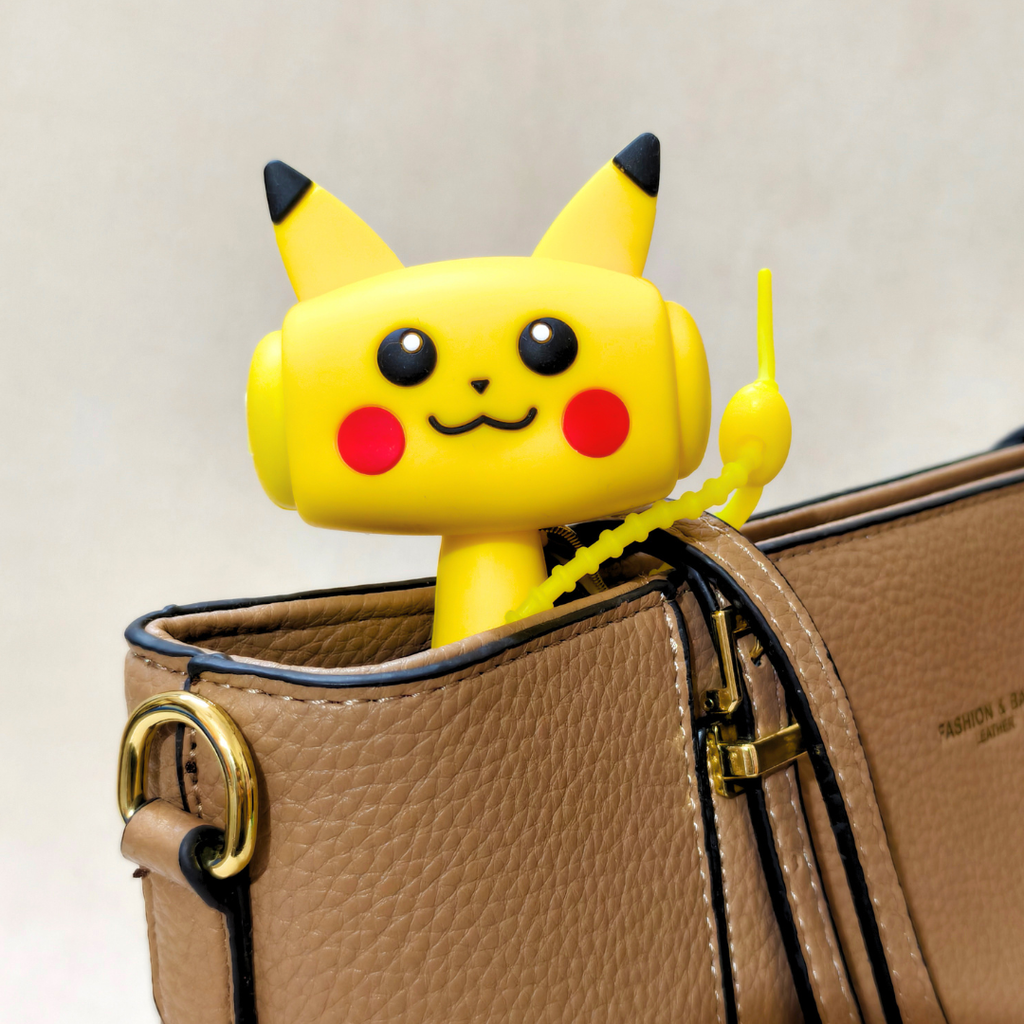 A yellow Pikachu-themed zip tie with a dangling yellow loop is shown clipped onto a brown textured handbag against a light beige background.