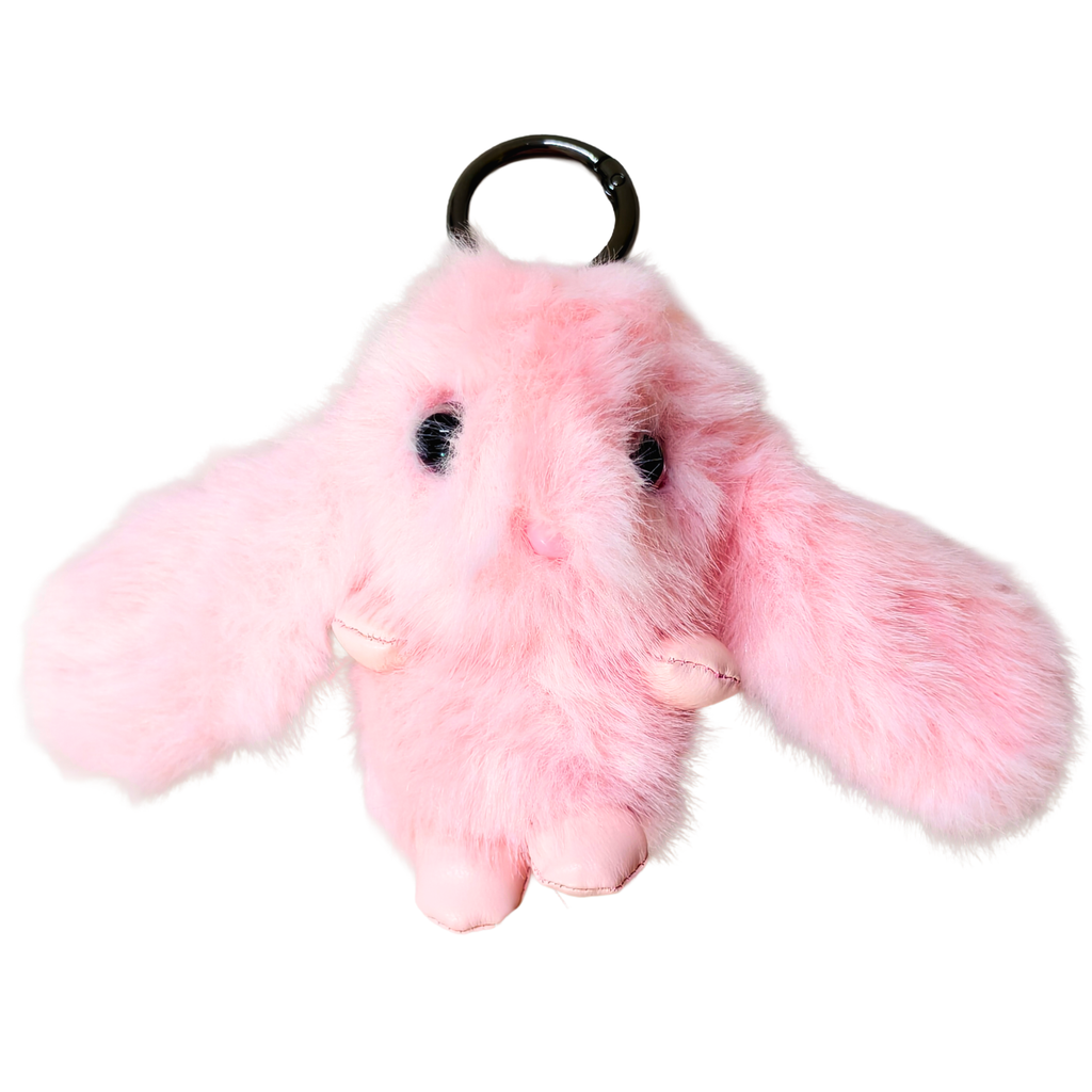 A pink fluffy bunny keychain with long floppy ears, black bead eyes, and a black plastic key ring, shown on a plain white background.