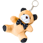 A plush teddy bear keychain in light brown with a white snout, black polka-dot bow tie, and black polka-dot ears and paw pads, attached to a silver metal key ring on a plain white background.